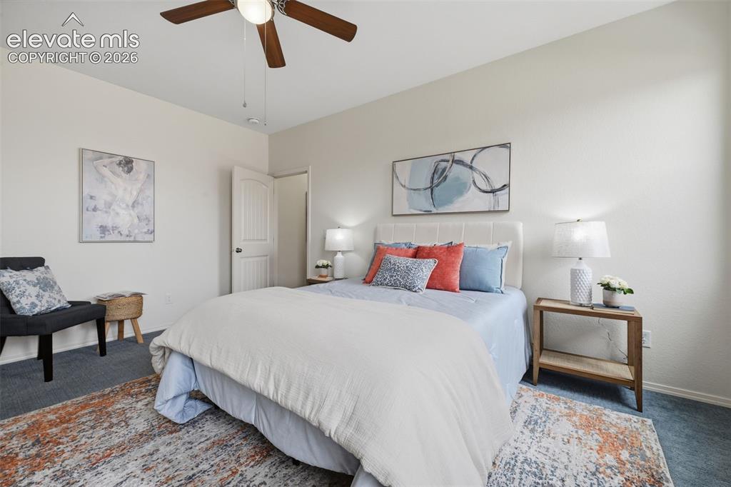 Image 21 of 37: Primary bedroom with walk in closet with adjustable shelving to organize yo