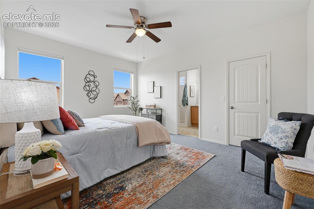 Image 22 of 37: View of Primary towards bathroom ensuite and door to walk in closet with or