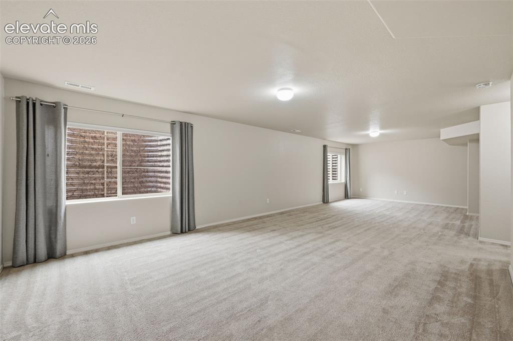 Image 26 of 37: View of game room area and family room areas combined