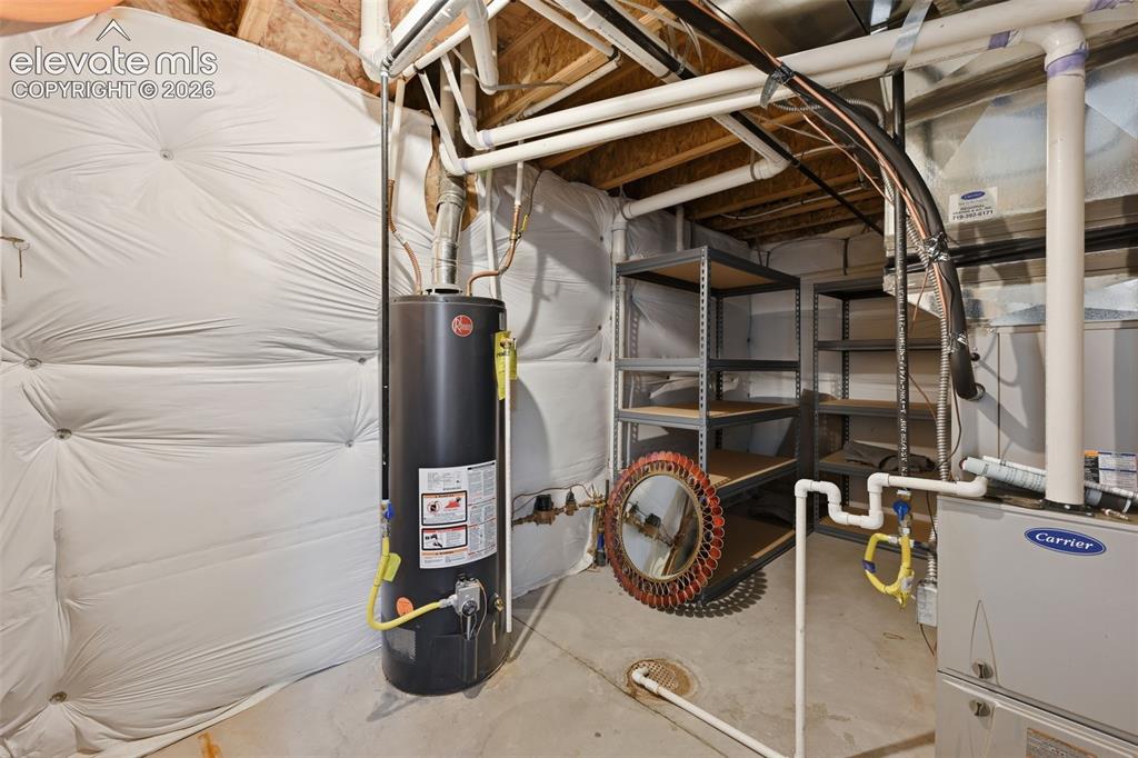 Image 33 of 37: Basement Mechanical and Storage room great for seasonal storage.