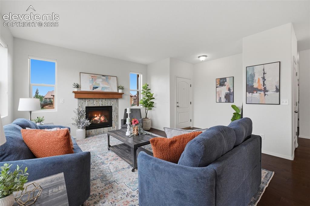 Image 5 of 37: End unit townhome has abundant light from all the windows in the living roo