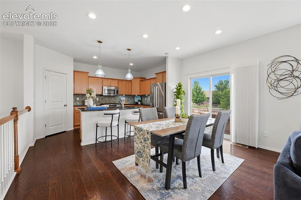 Image 8 of 37: Dining area combined with the living room and kitchen make for great entert