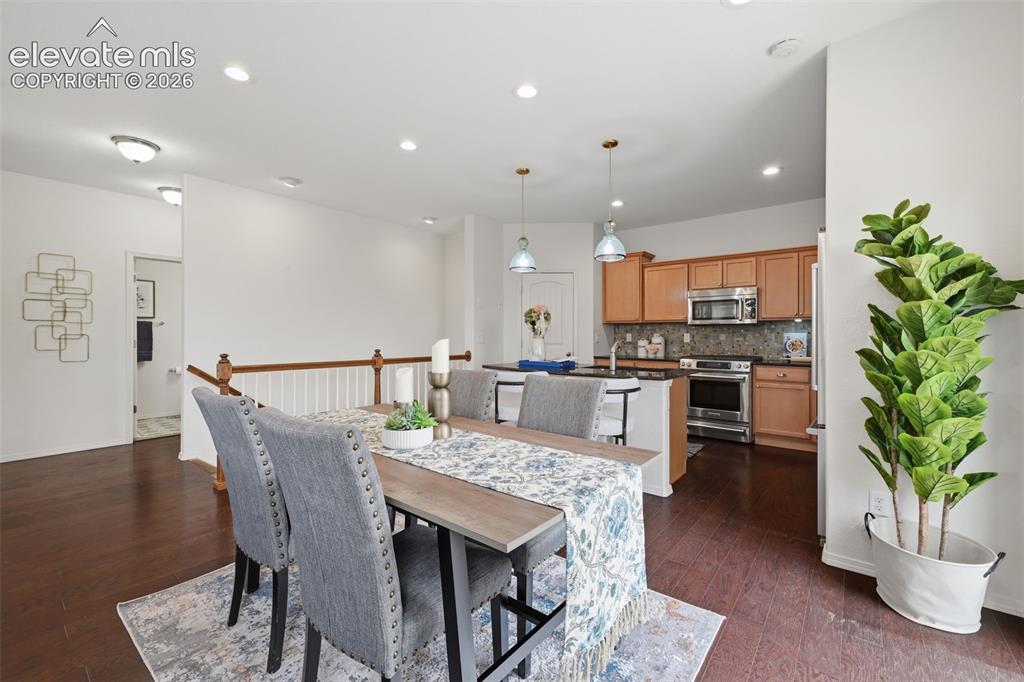 Image 9 of 37: View of dining room toward gourmet kitchen with walk in pantry and beautifu