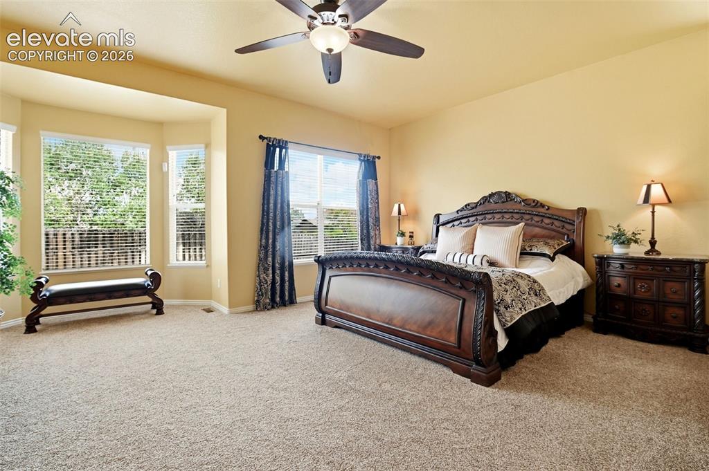 Image 10 of 41: Soaring ceilings and bright bay window fill the suite with natural light.  