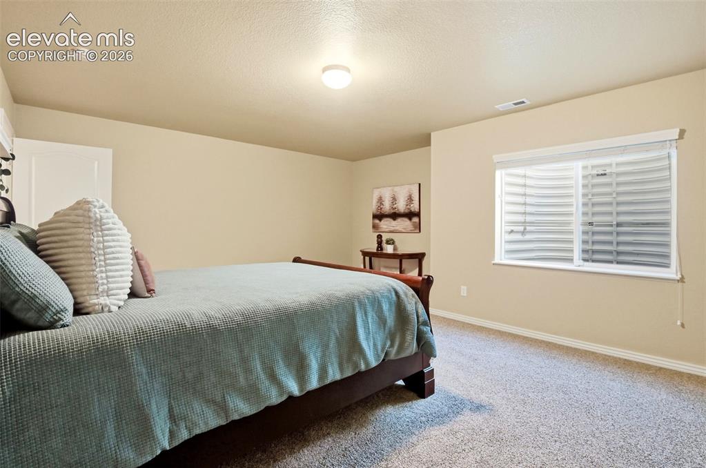 Image 29 of 41: Basement offers 3 oversized bedrooms with neutral finishes and walk in clos