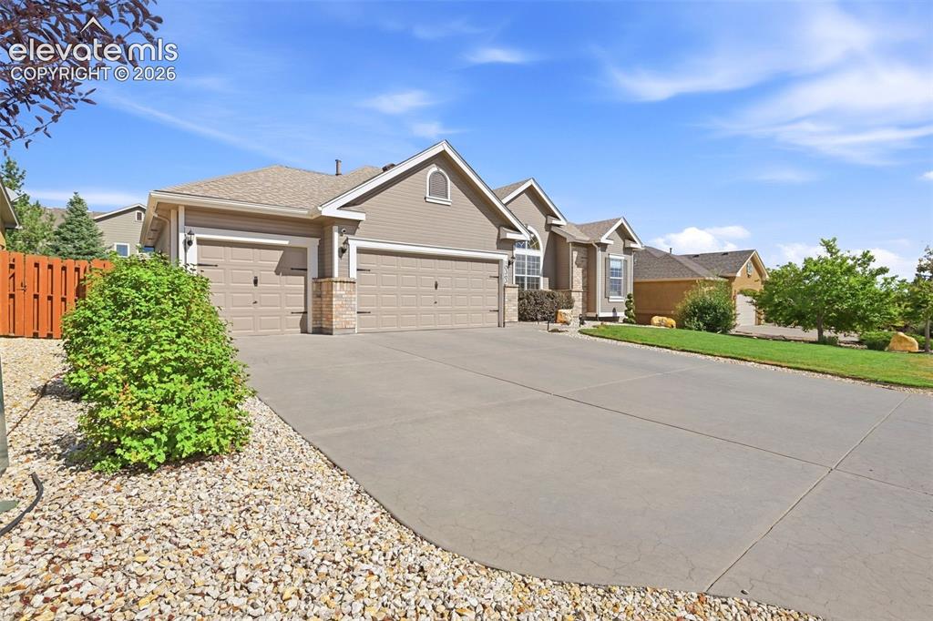 Image 3 of 41: Home has 3-car tandem garage with high ceilings - great for off ground stor