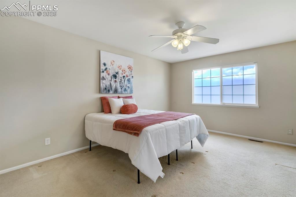 Image 15 of 24: Bedroom featuring carpet and a ceiling fan