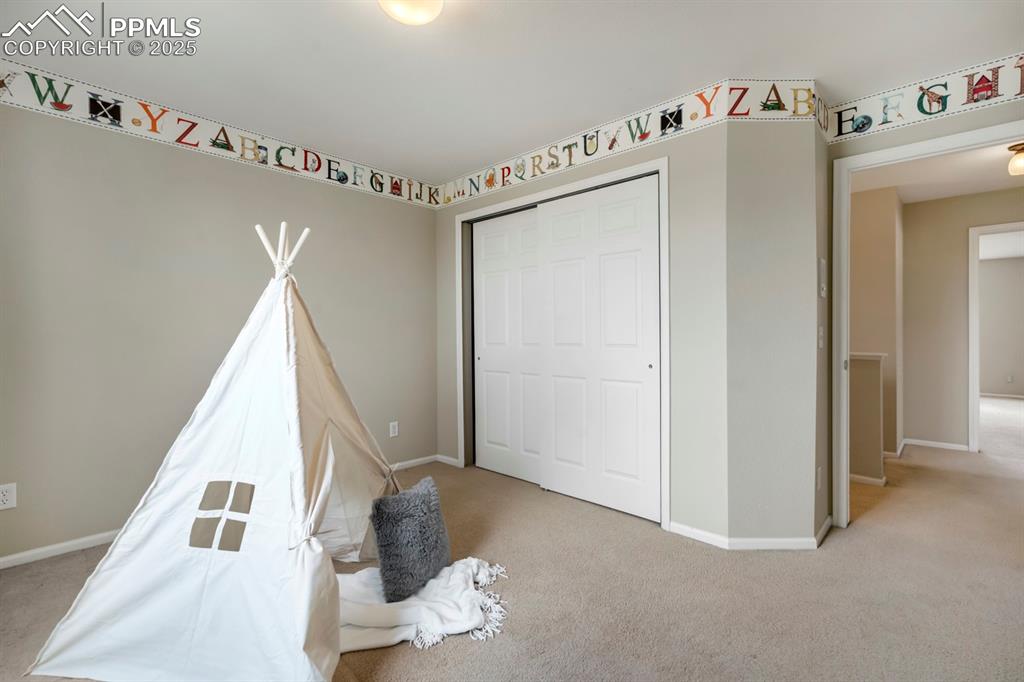 Image 17 of 24: Playroom with light carpet