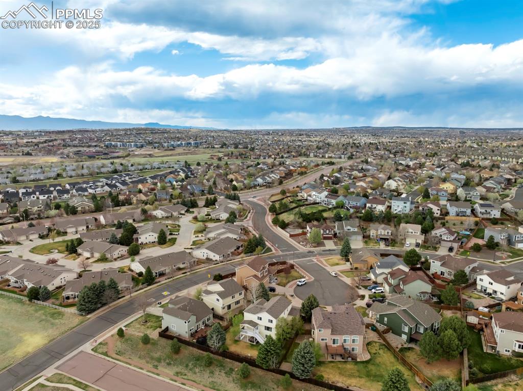 Image 22 of 24: View of property location with nearby suburban area