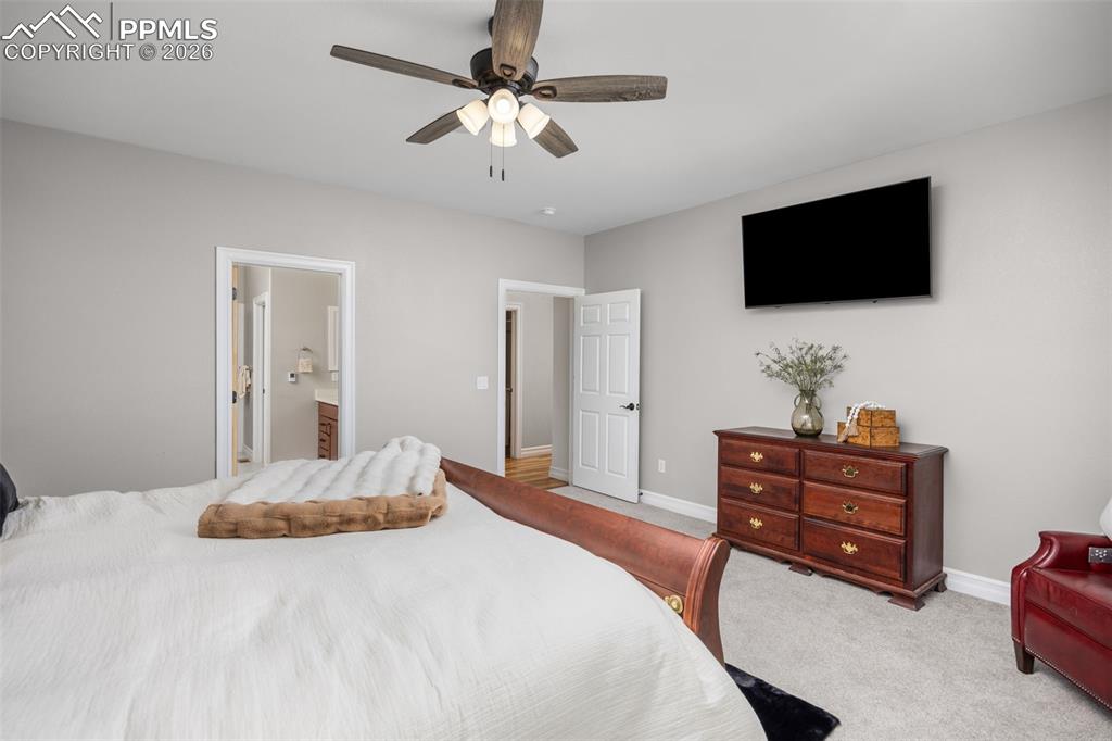 Image 17 of 49: This room features light grey walls and light grey carpet