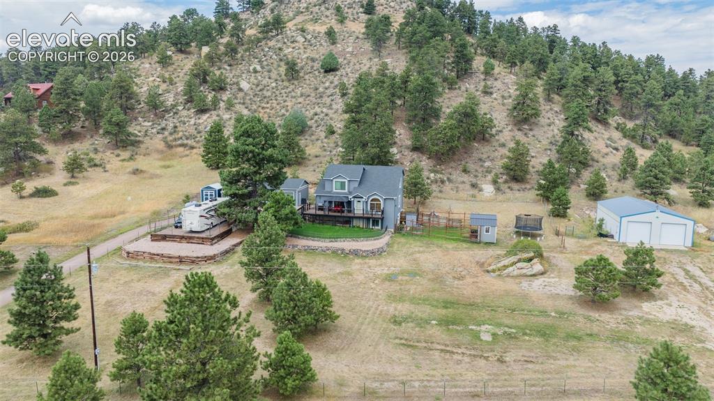 Caption: A turn key 5 ACRE retreat... private and perfect with nice home, several outbuildings including the 