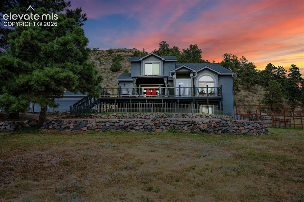 Image 3 of 47: A gorgeous setting for a very nice home; fenced yard, 5 Acres with no maint