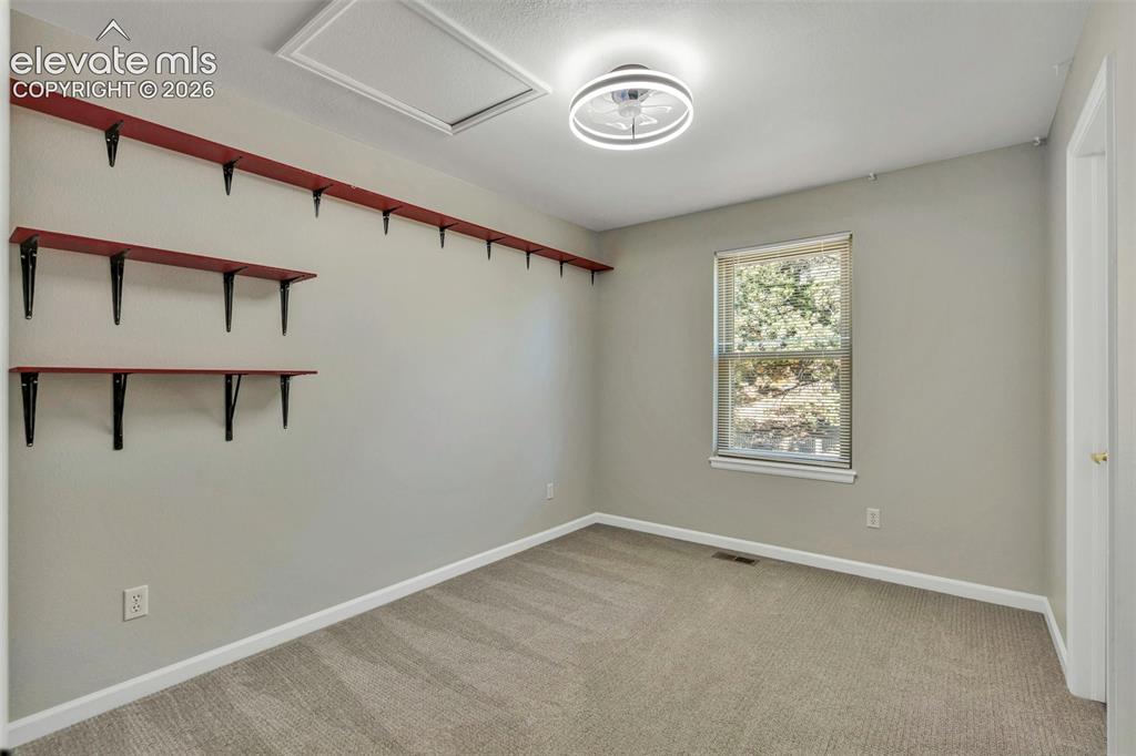 Image 32 of 47: Unfurnished room featuring light carpet and baseboards