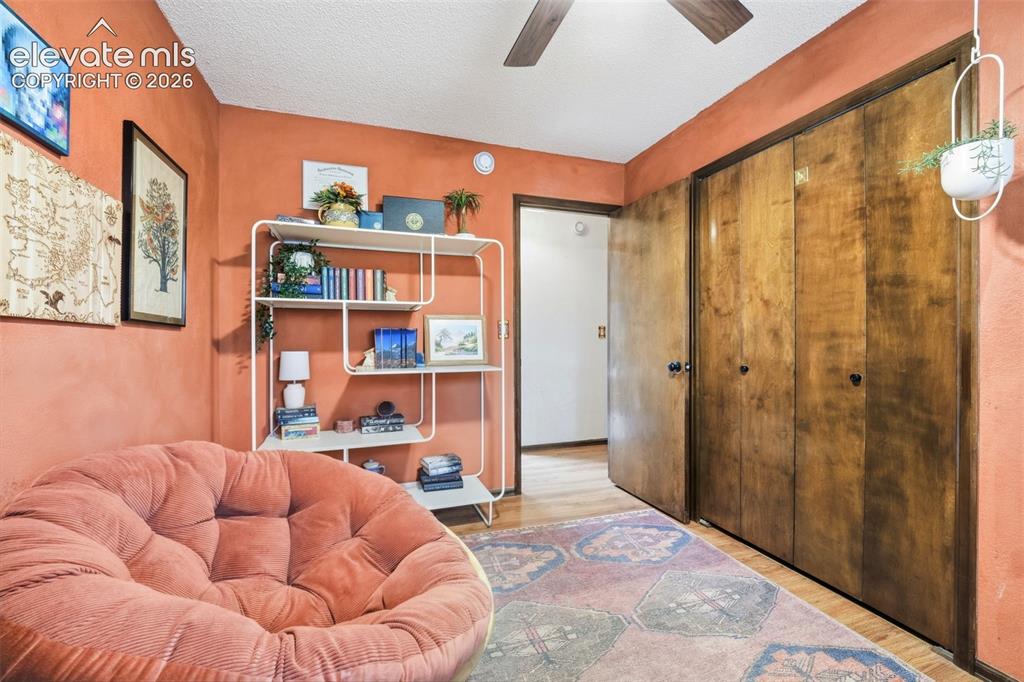 Image 21 of 42: Room featuring wood-finish flooring and a wood ceiling fan