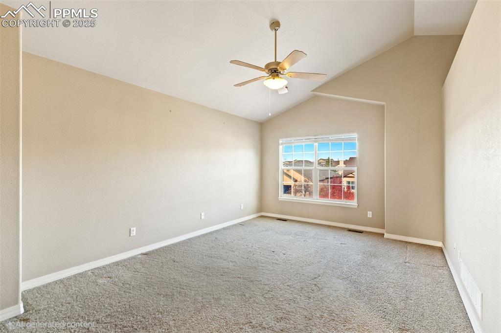 Image 19 of 34: Spacious primary suite includes this spacious bedroom with vaulted ceilings