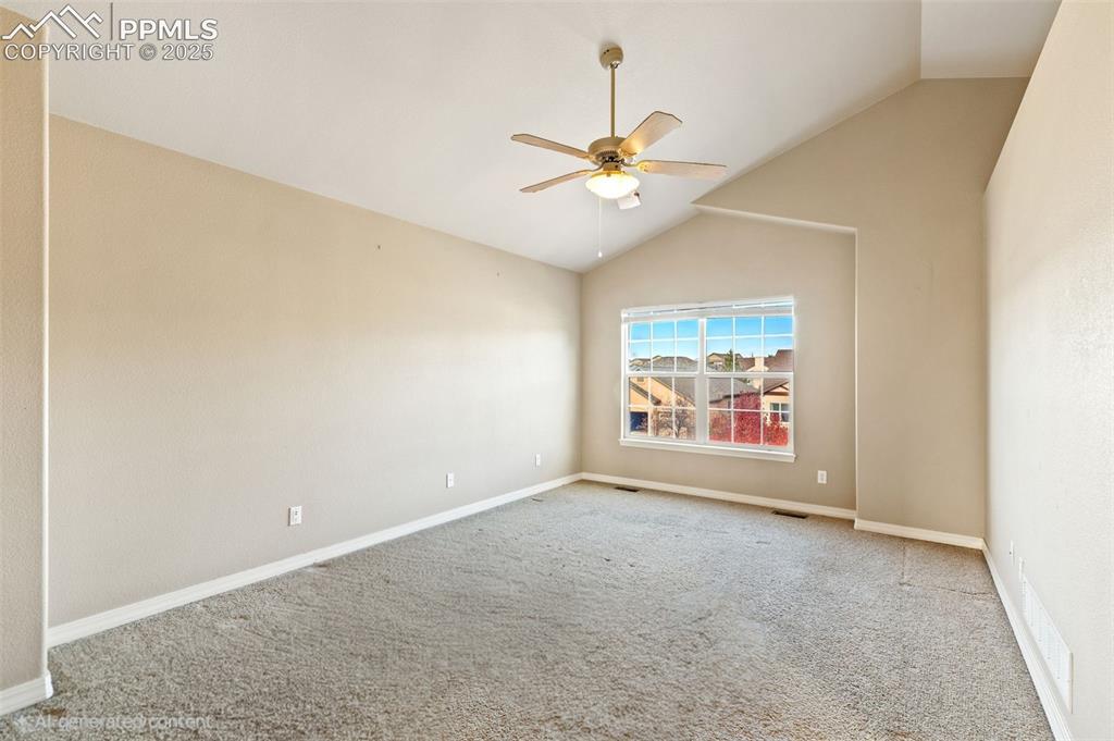 Image 21 of 36: Spacious primary suite includes this spacious bedroom with vaulted ceilings