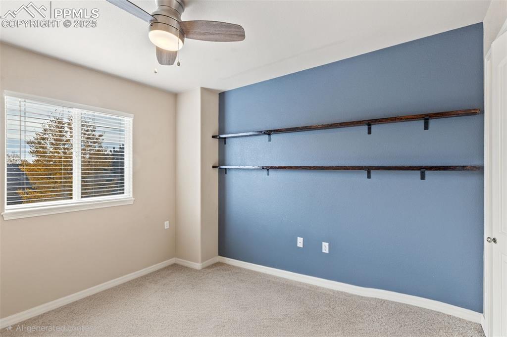 Image 26 of 36: Bedroom 3 on the upper level has been used as an office.