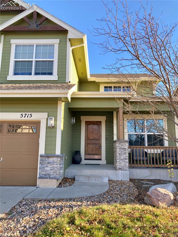 Image 3 of 36: The welcoming covered front porch is the perfect place to relax and enjoy t