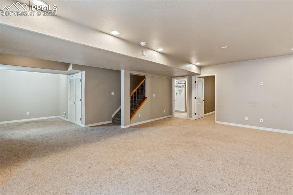 Image 30 of 36: View 2 of the oversized basement family room. Imagine all of the ways you c