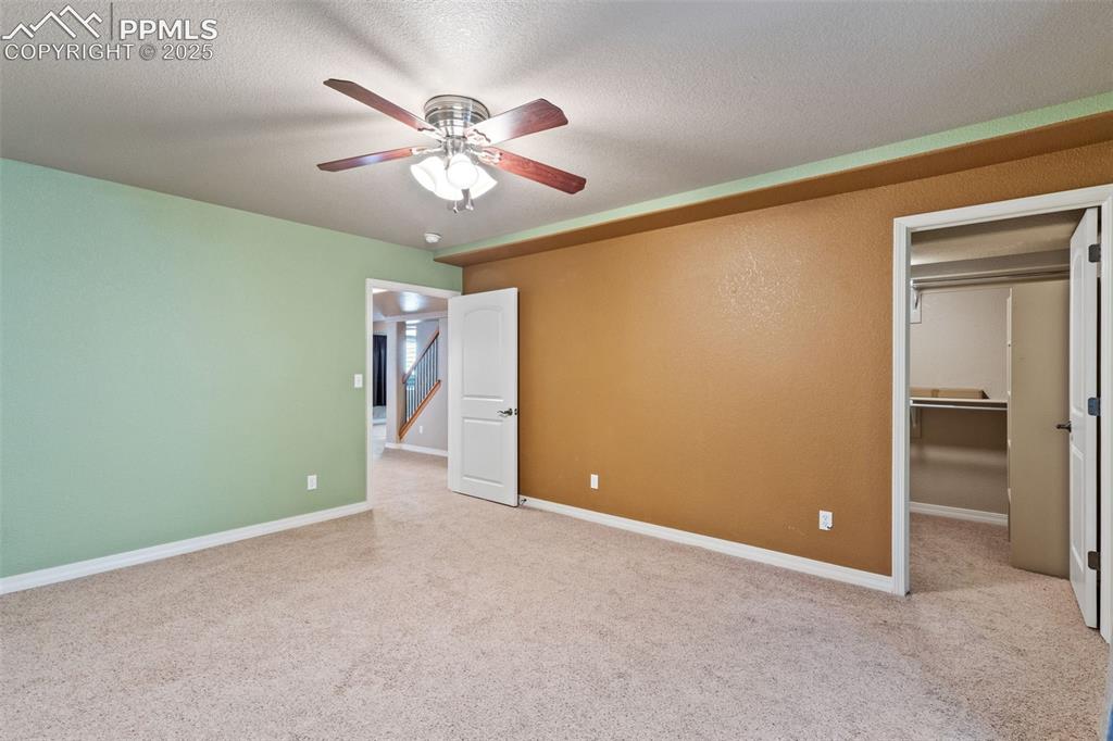 Image 33 of 36: Basement bedroom 4 includes an oversized walk-in closet.