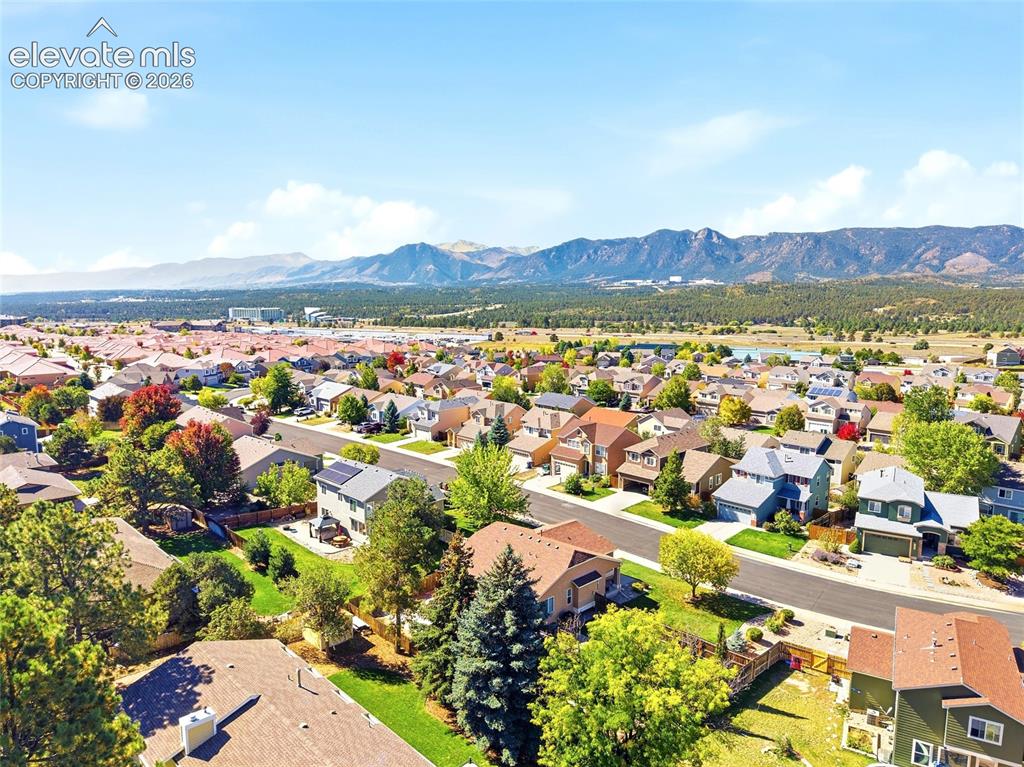 Image 47 of 50: Community setting with surrounding mountain range backdrop