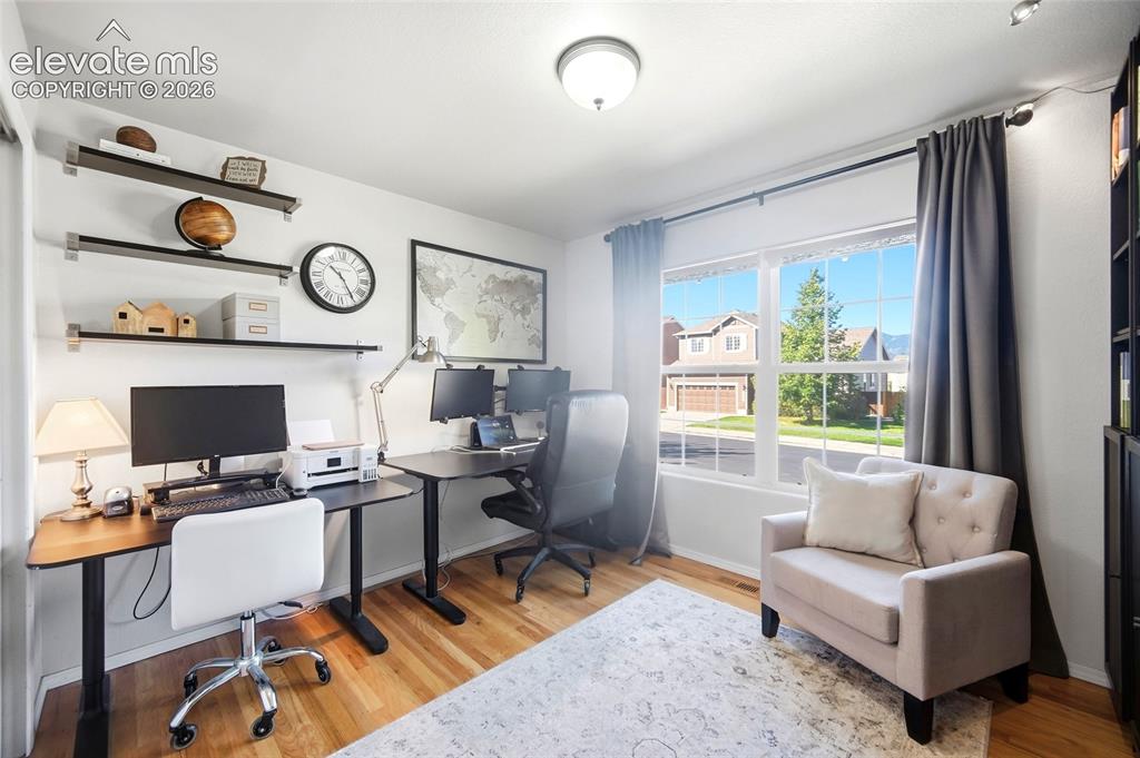 Image 7 of 50: Hardwood-style flooring throughout