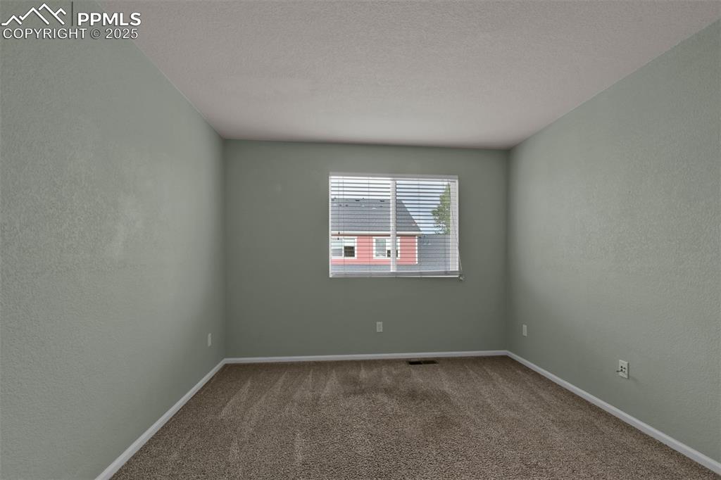 Image 32 of 38: Home office or 3rd bedroom featuring light carpet