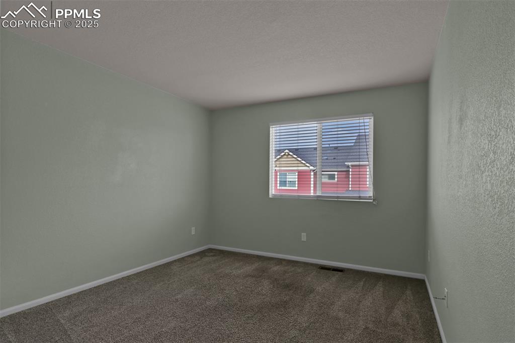 Image 36 of 38: 3rd carpeted bedroom north facing