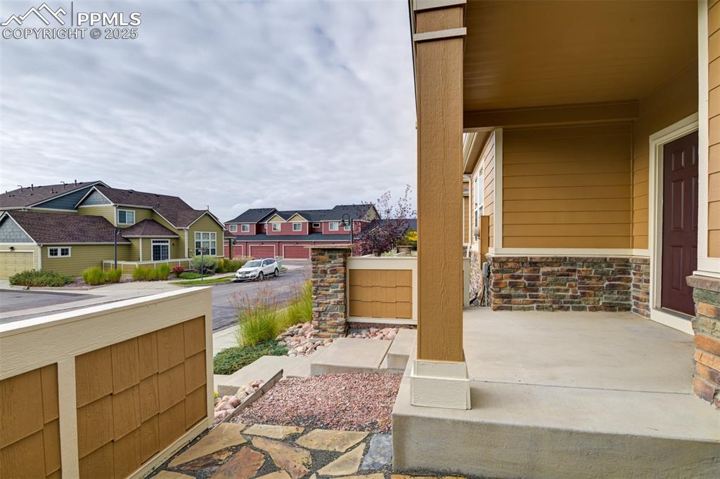 Image 4 of 38: Porch featuring a residential view