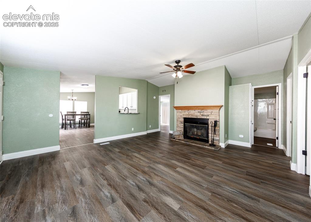 Image 8 of 26: Living room with fireplace