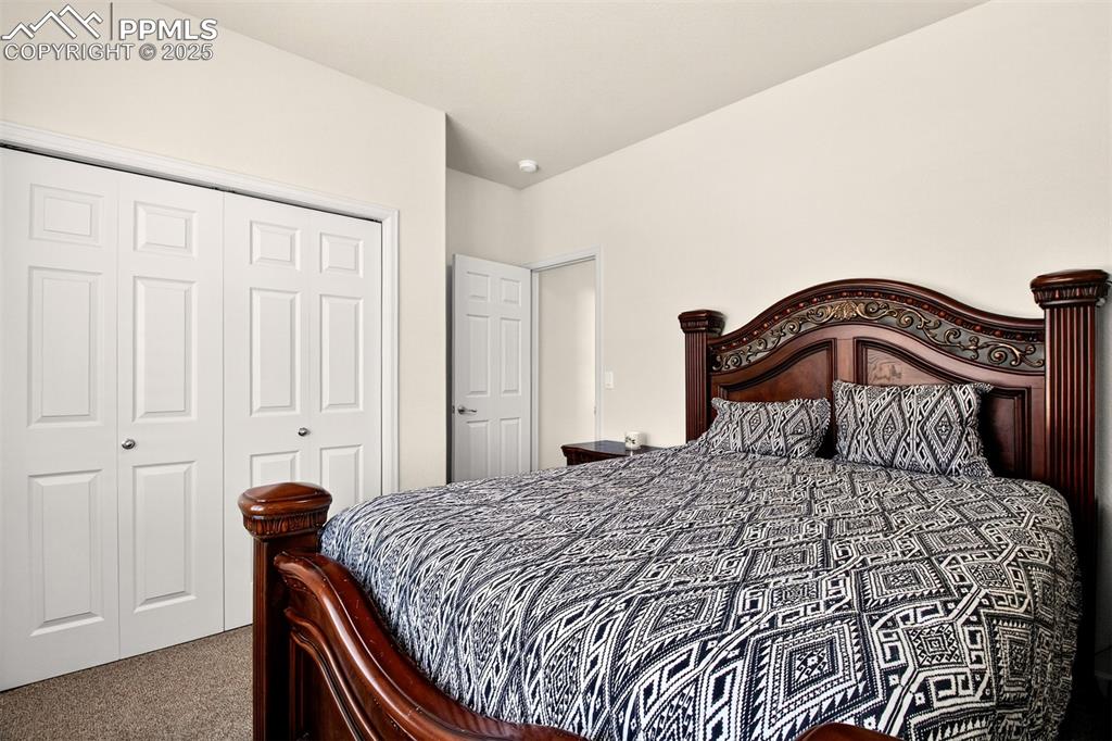 Image 29 of 43: Bedroom featuring dark colored carpet and a closet