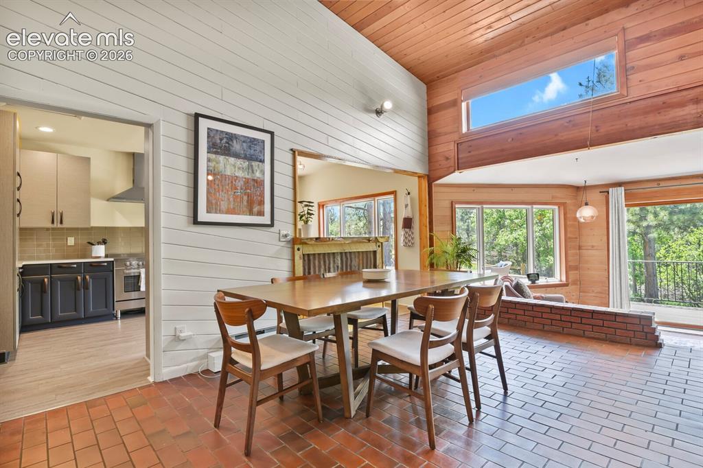 Image 15 of 49: Bright dining area perfectly positioned for everyday meals and memorable ga