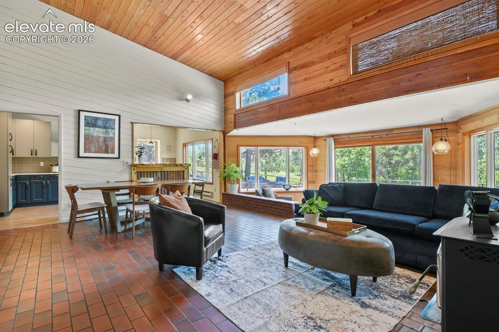 Image 17 of 49: Dramatic great room showcasing vaulted ceilings and mountain-inspired chara