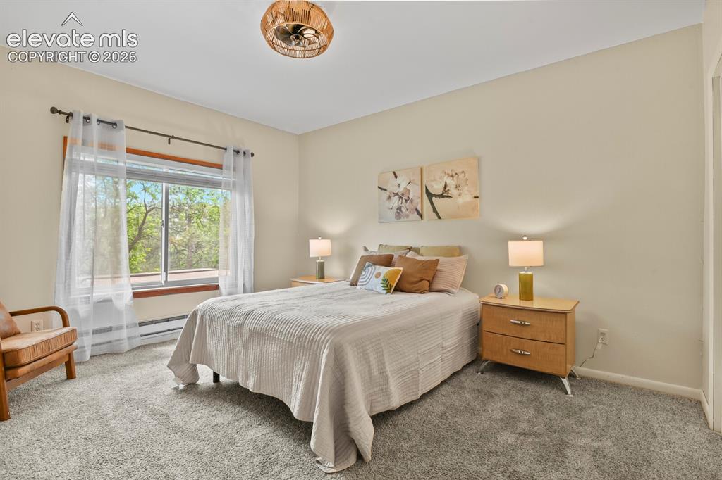 Image 21 of 49: Peaceful primary suite offering privacy and comfort.