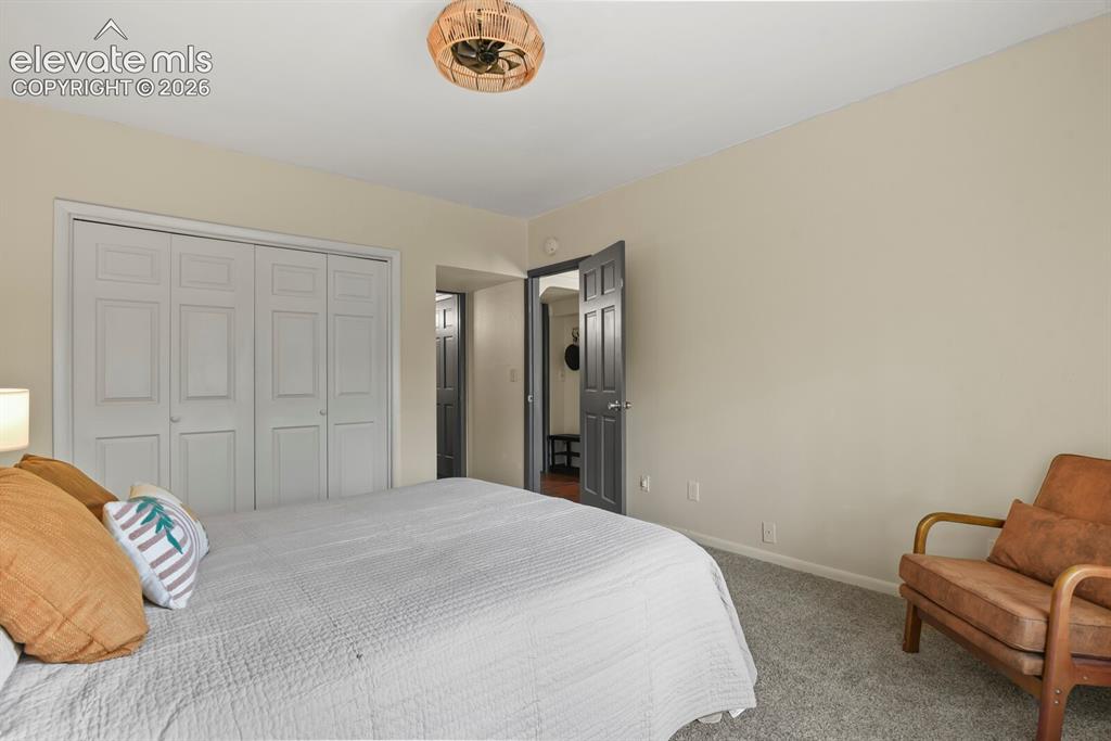 Image 23 of 49: Spacious secondary bedroom filled with natural light.