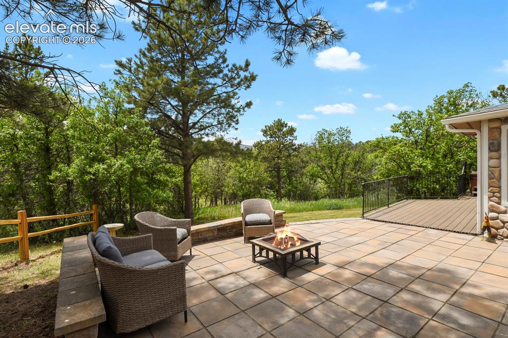 Image 31 of 49: Expansive patio designed for outdoor entertaining and relaxing evenings.