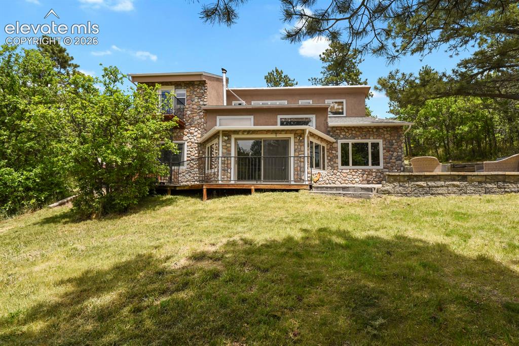 Image 34 of 49: Rear view highlighting the home