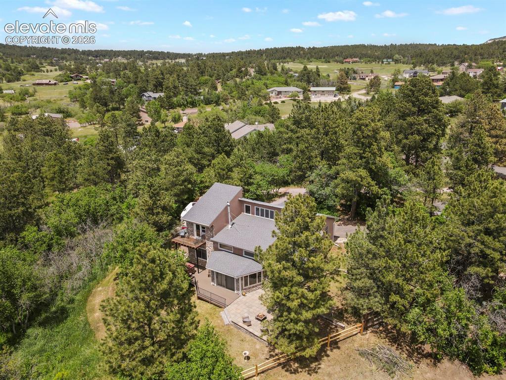 Image 44 of 49: Elevated aerial view highlighting the expansive 1.24-acre property.