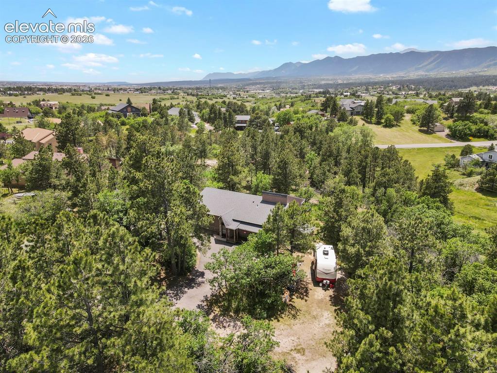Image 48 of 49: Mountain views and spacious neighboring properties create a remarkable sett