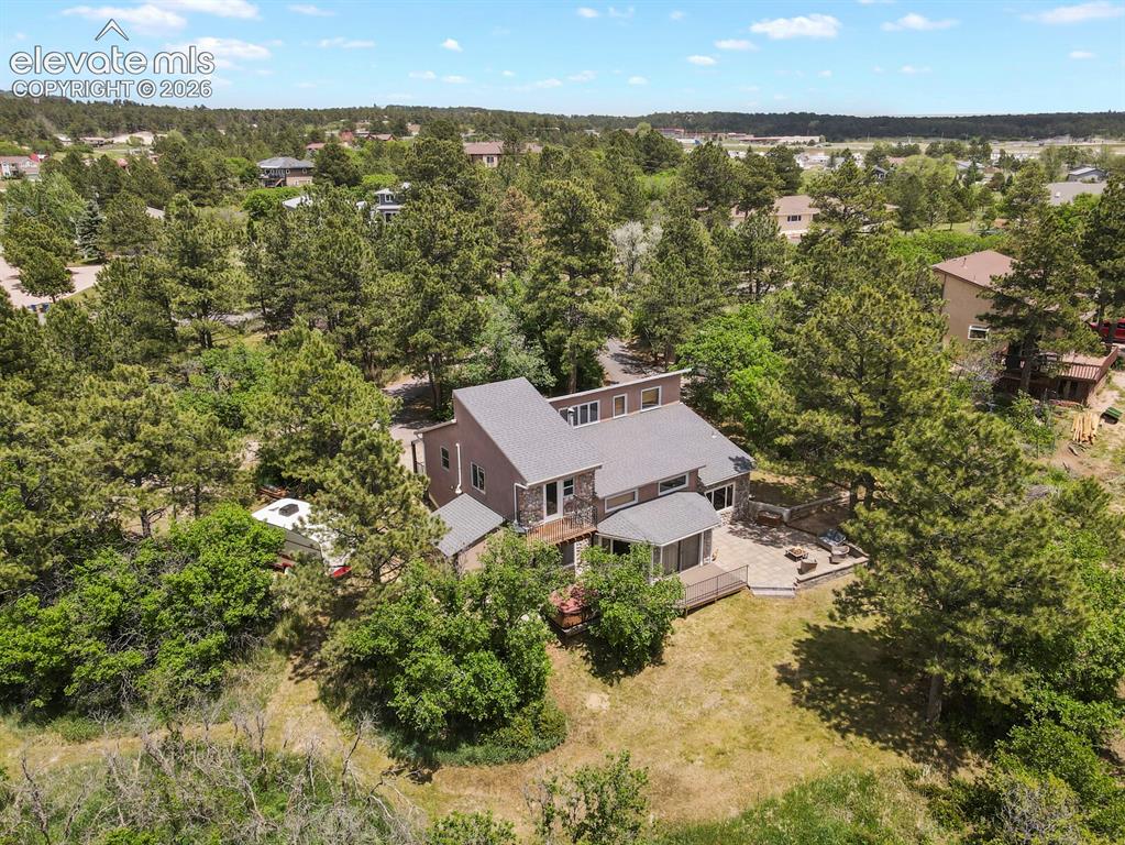 Image 7 of 49: Nestled among mature pines on 1.24 beautiful acres.