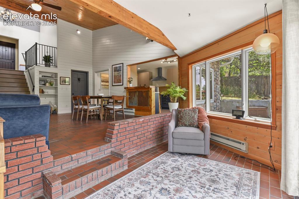 Image 8 of 49: Step inside to soaring ceilings and abundant natural light.