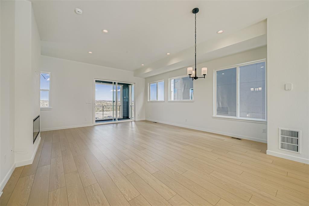 Image 3 of 13: Unfurnished living room featuring recessed lighting, a chandelier, and ligh