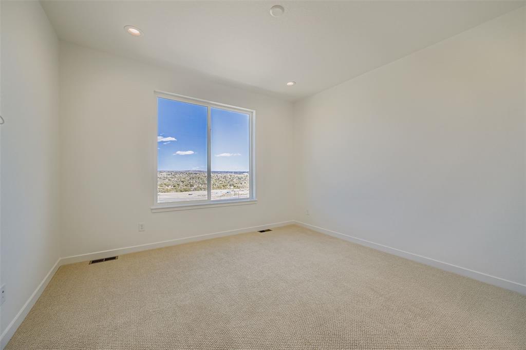 Image 8 of 13: Unfurnished room with light carpet and recessed lighting