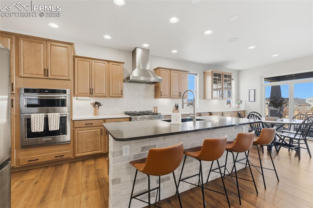 Image 11 of 44: Beautiful Brick Style Backsplash Also Used On Face Of Center Island