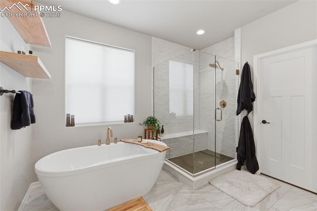 Image 17 of 44: Walk-In Shower & Stand-Alone Soaking Tub In Adjoining Primary Bath
