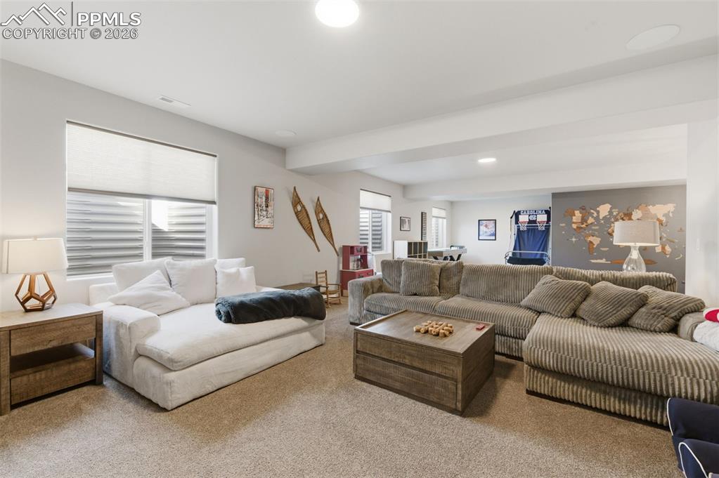 Image 26 of 44: Family Room Extends To Back Wall, Wet Bar Is To The Right