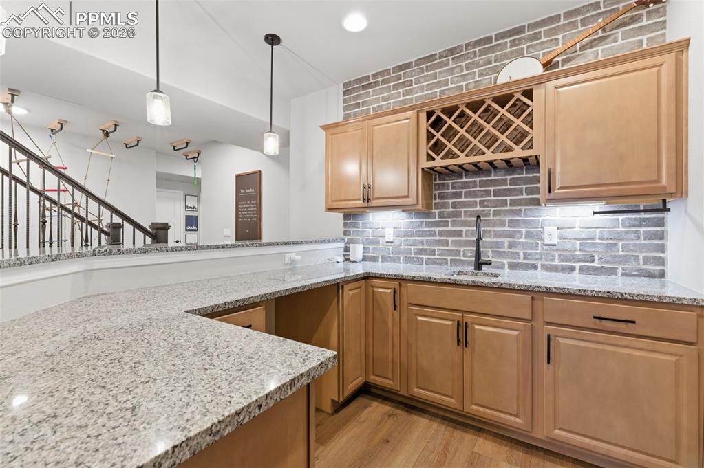 Image 29 of 44: Notice All The Cabinets And Brick Backsplash In The Wet Bar!