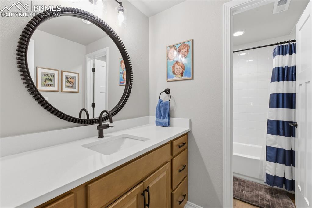 Image 33 of 44: Lower Level Bathroom w/Granite Countertop
