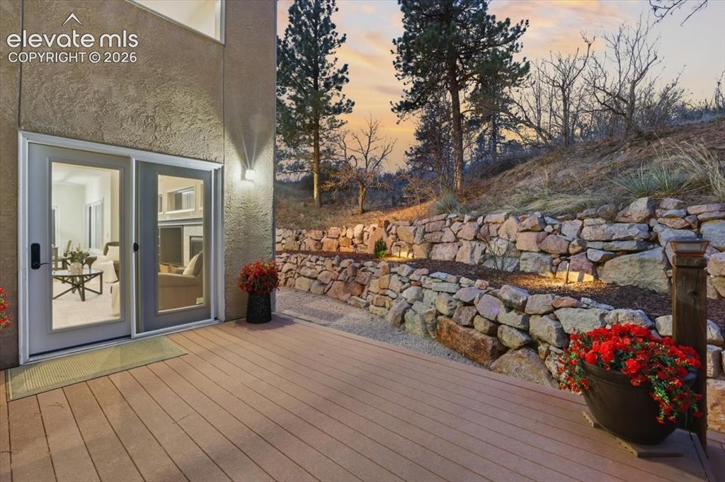 Image 40 of 48: Spacious composite deck with stucco exterior