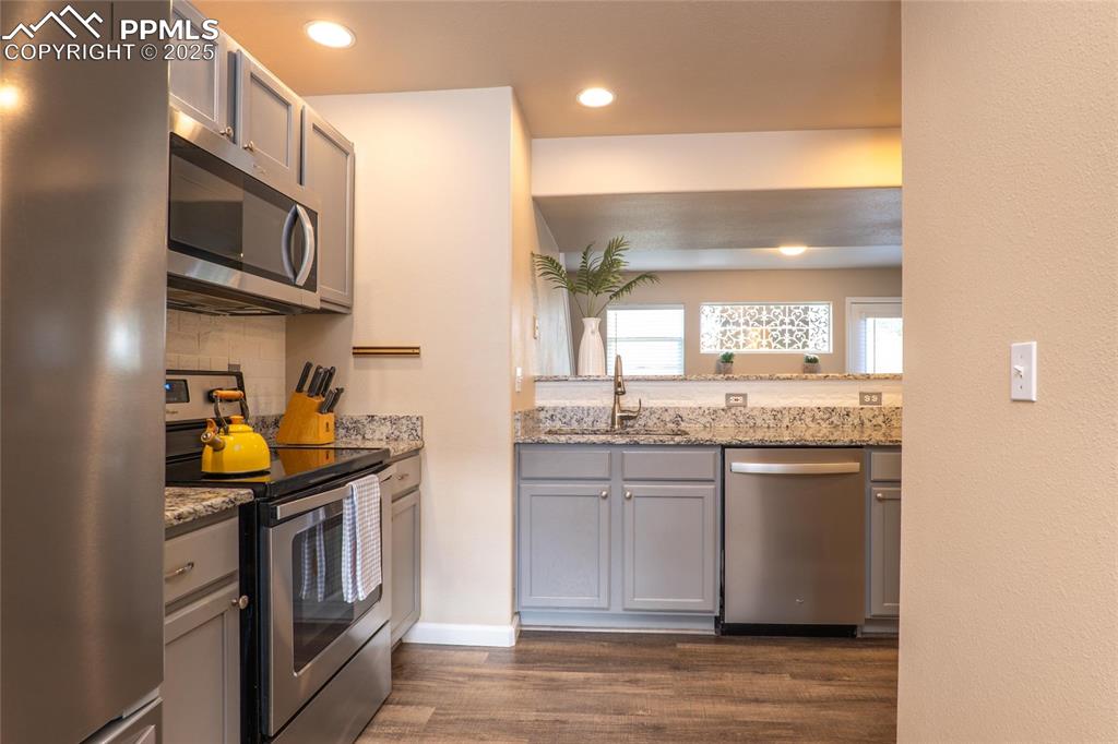 Image 4 of 25: Kitchen opens to the family room.